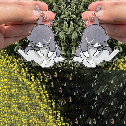 Playing with eggs and kitten keychain