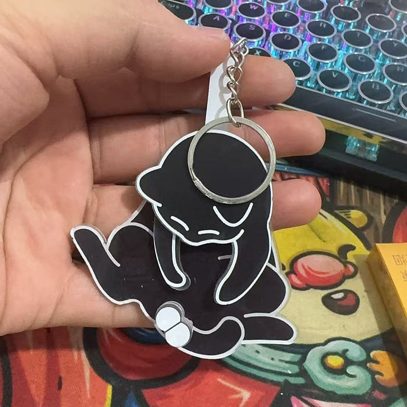 Playing with eggs and kitten keychain