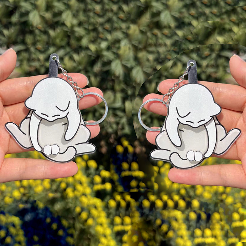 Playing with eggs and kitten keychain